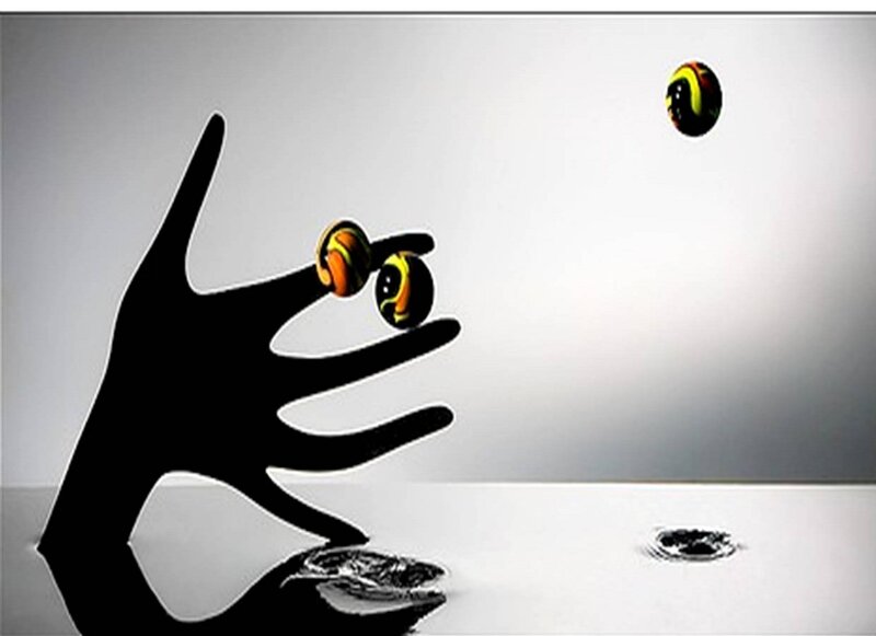 Silhouette Hand with Marbles
