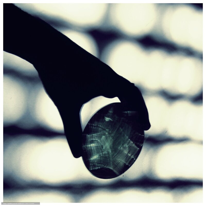 silhouette holding crystal ball