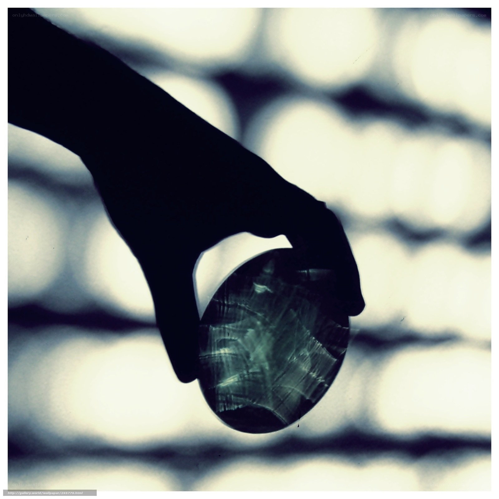 silhouette holding crystal ball