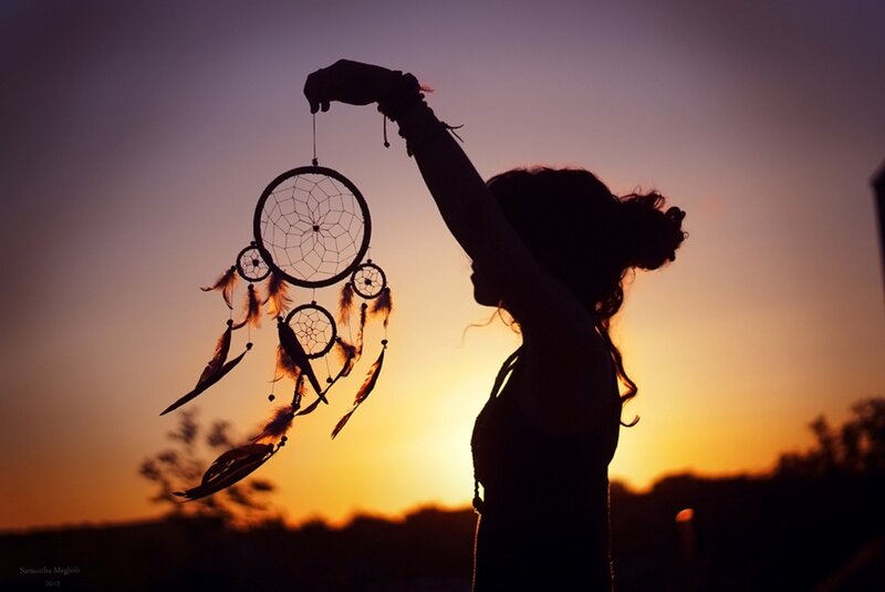 Silhouette Holding Dreamcatcher — Orange