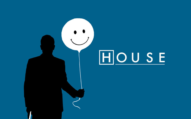 silhouette holding smiley balloon