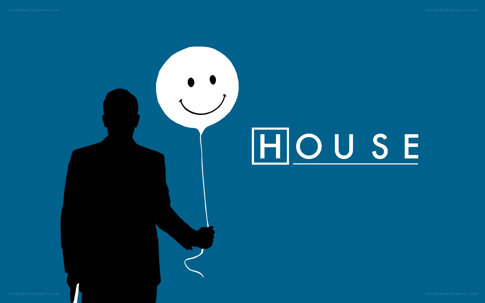 silhouette holding smiley balloon