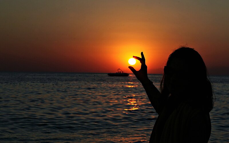 Silhouette Holding Sun — Orange, Dramatic, Sunset, Photograph