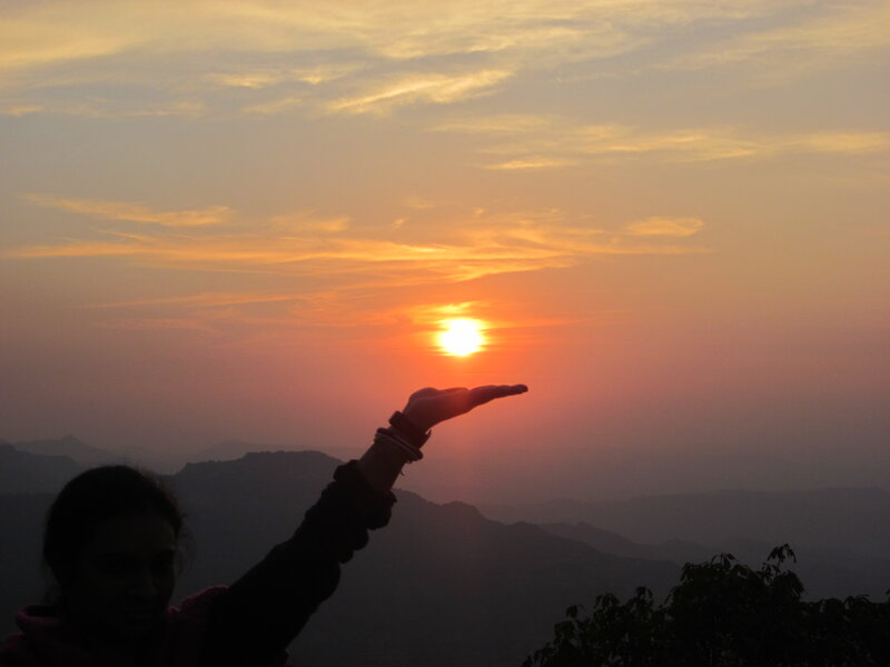 Silhouette Holding Sun — Orange, Serene