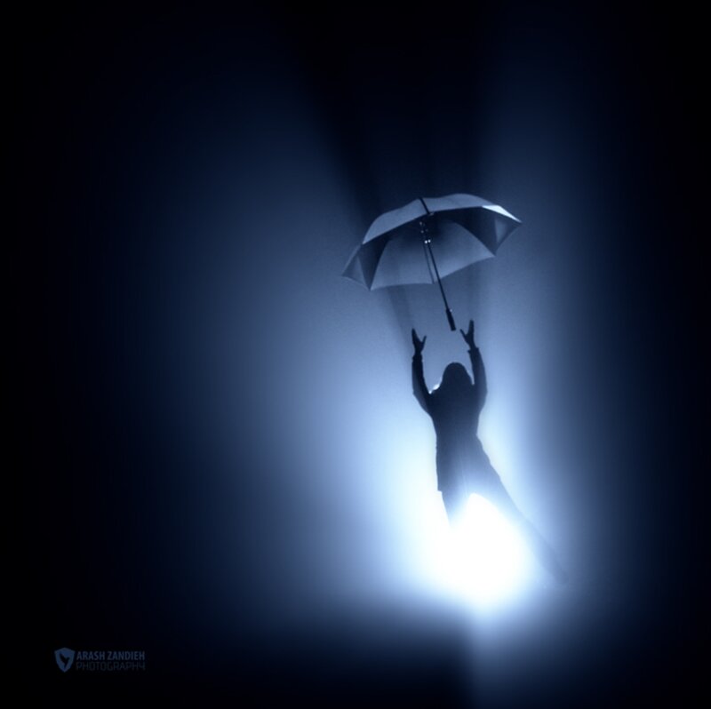 Silhouette Holding Umbrella — Blue