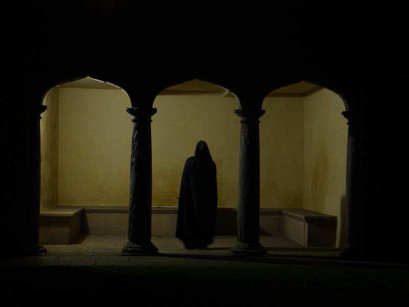 Silhouette in a cloaked figure