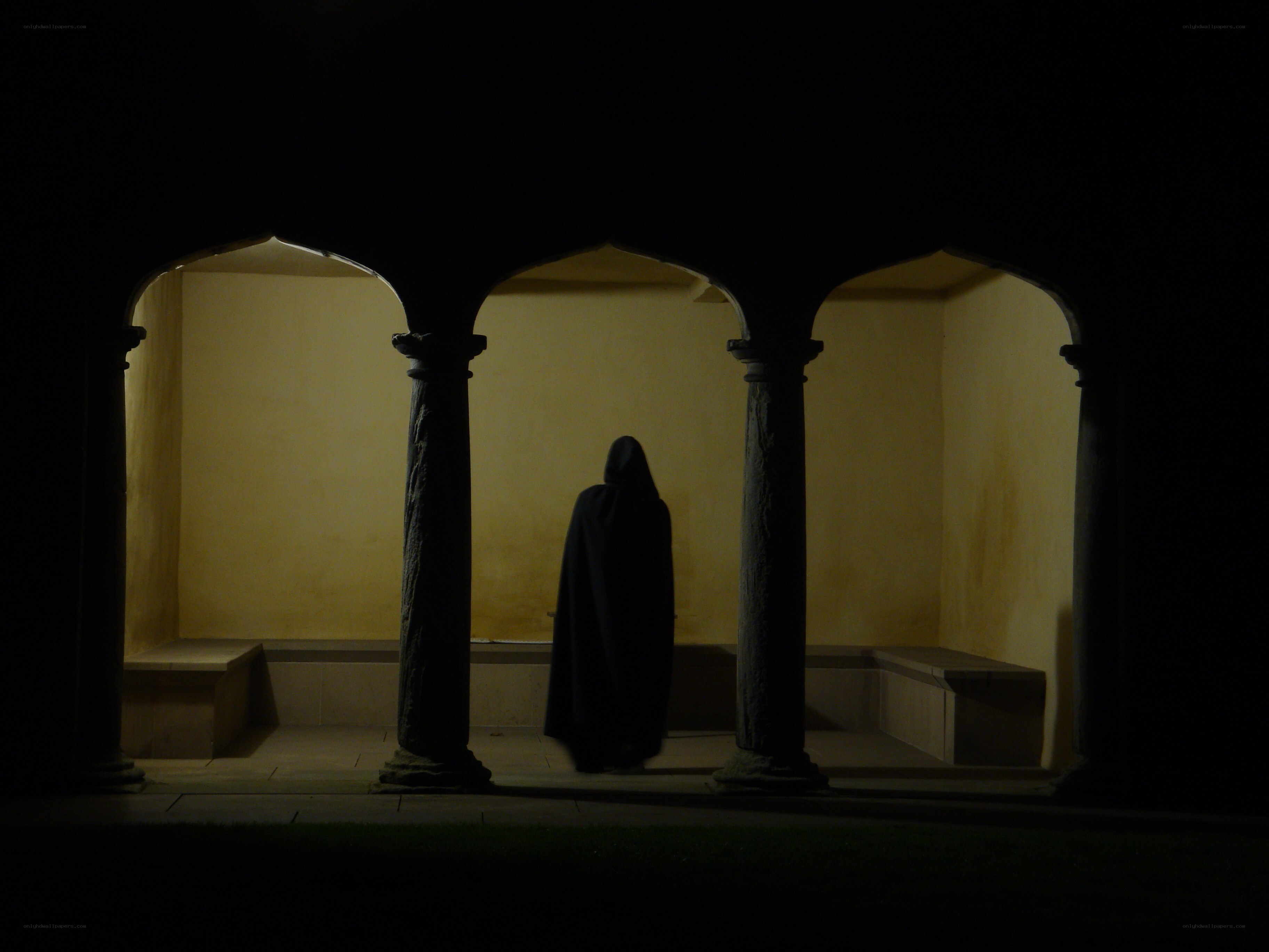Silhouette in a cloaked figure