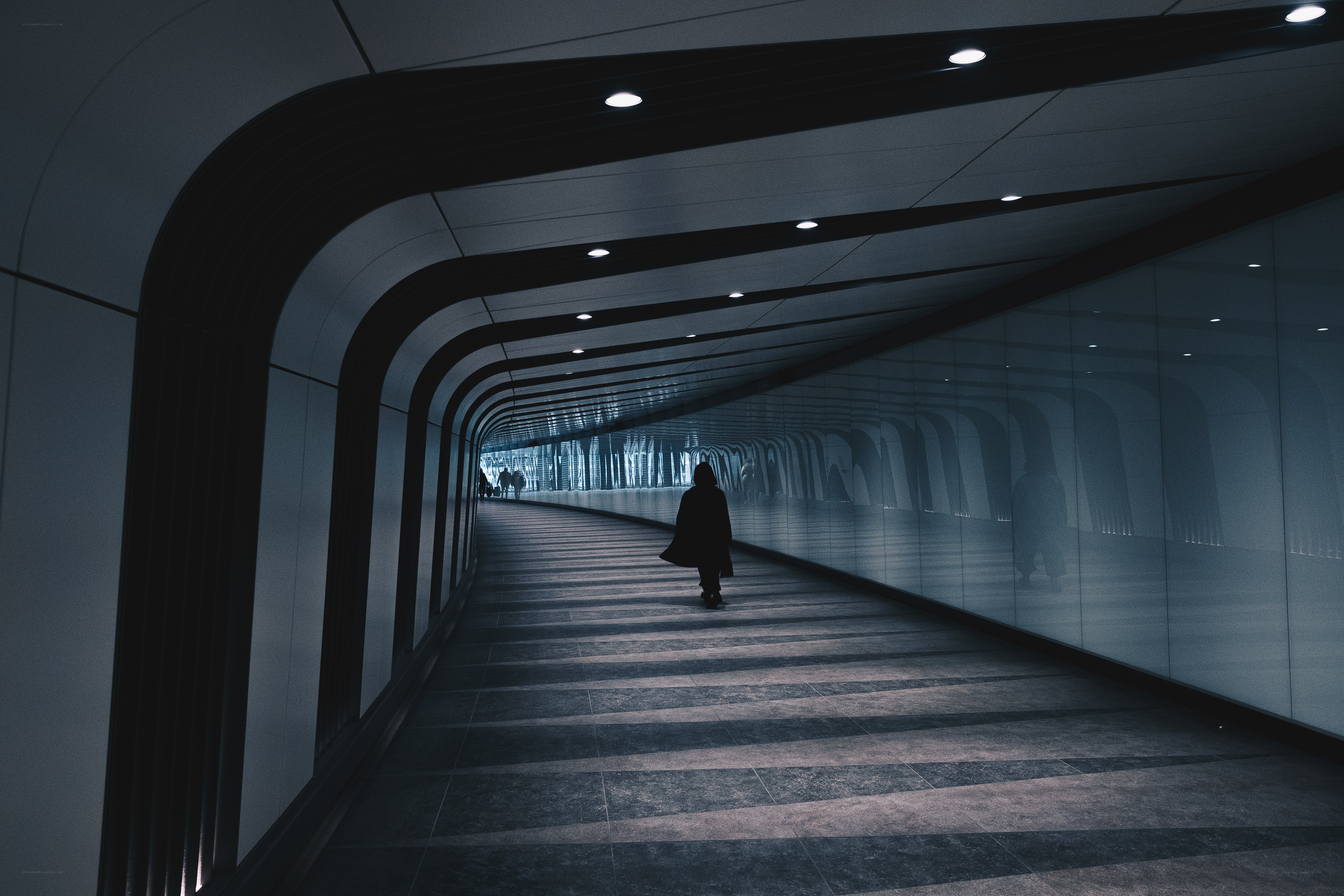 Silhouette in a curved tunnel