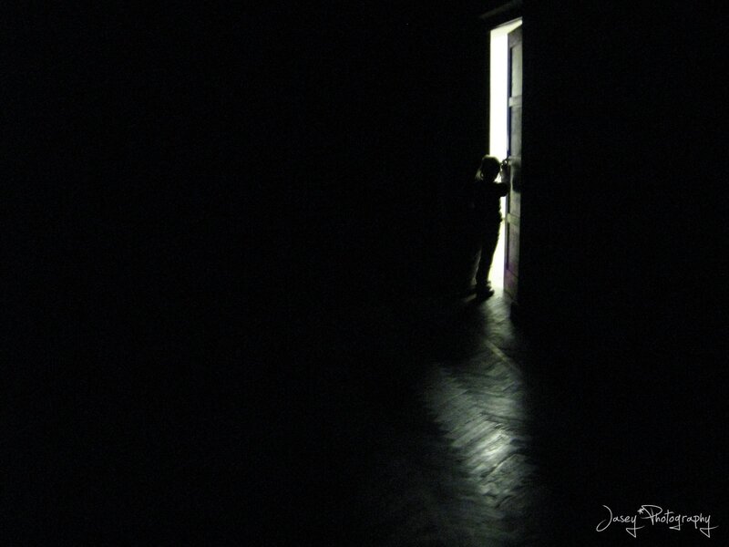 silhouette in a dark hallway