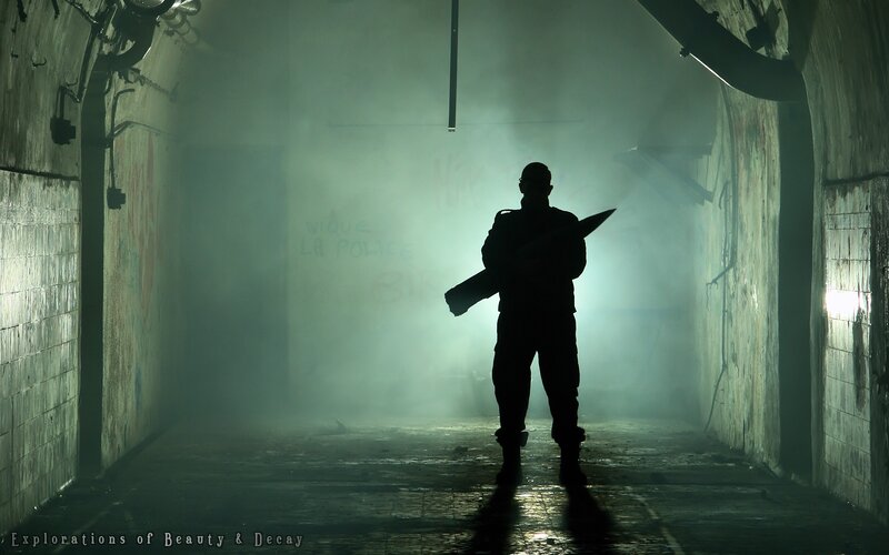 Silhouette in a smoky tunnel