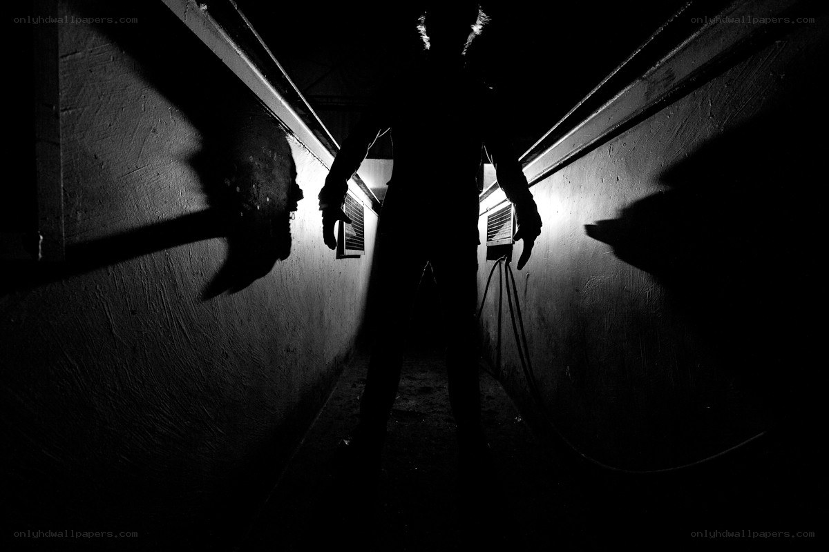 Silhouette in dark corridor