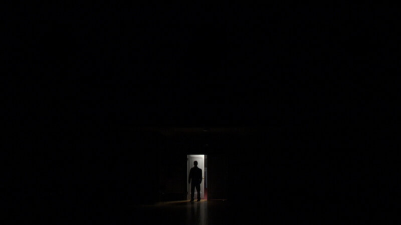 silhouette in dark hallway