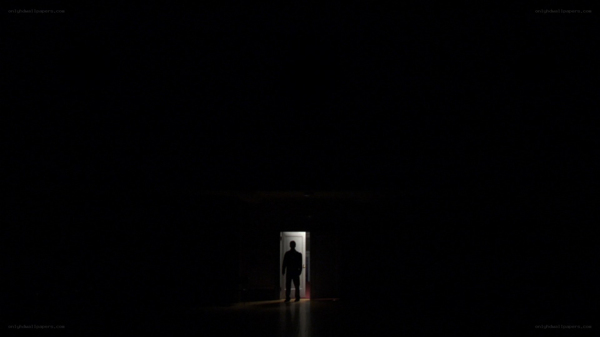 silhouette in dark hallway