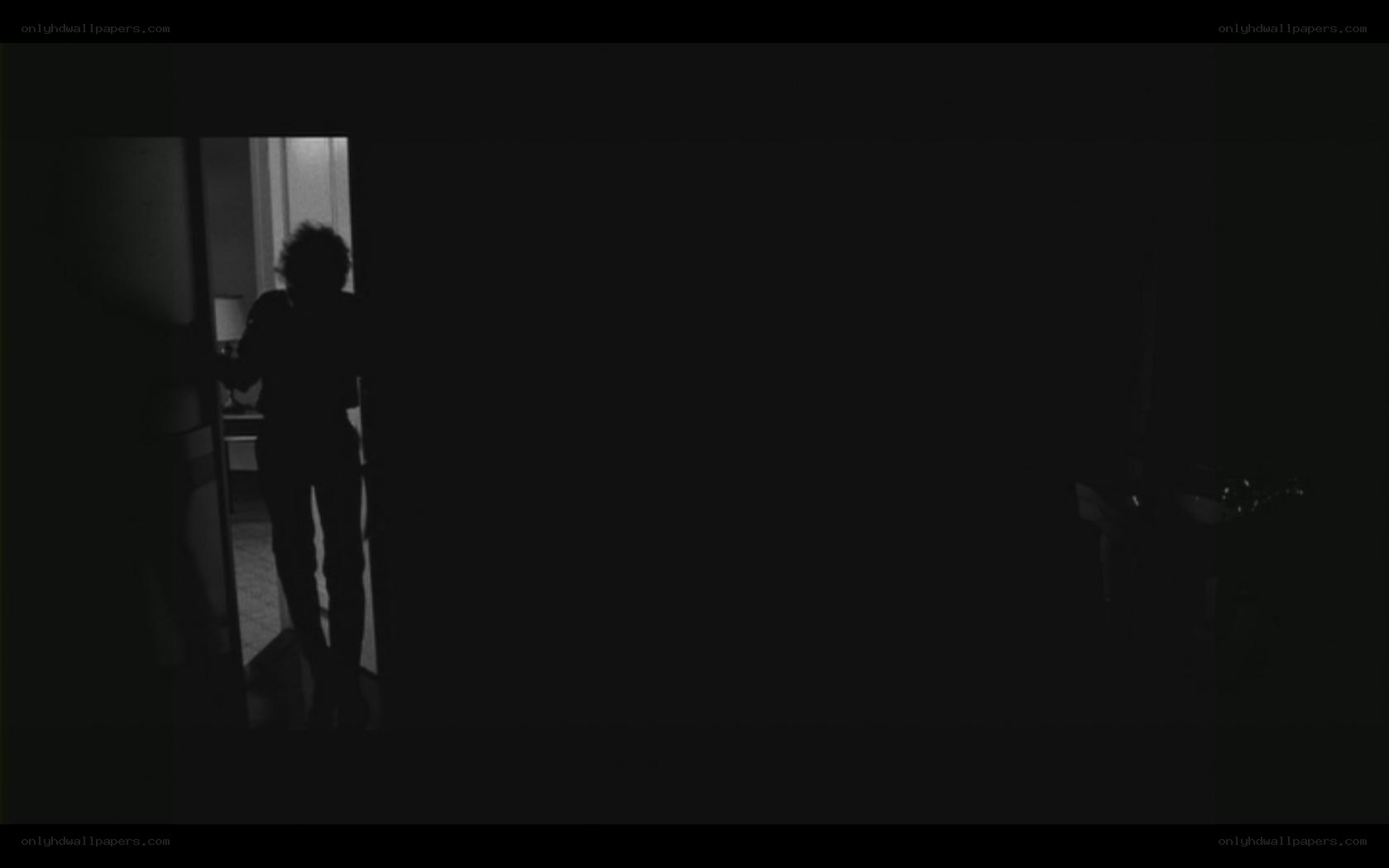 silhouette in dark room