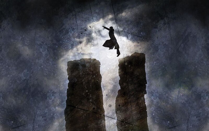 Silhouette Jumping Between Cliffs