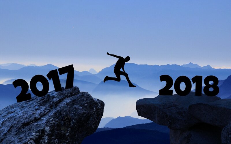 Silhouette Jumping Between Rocks