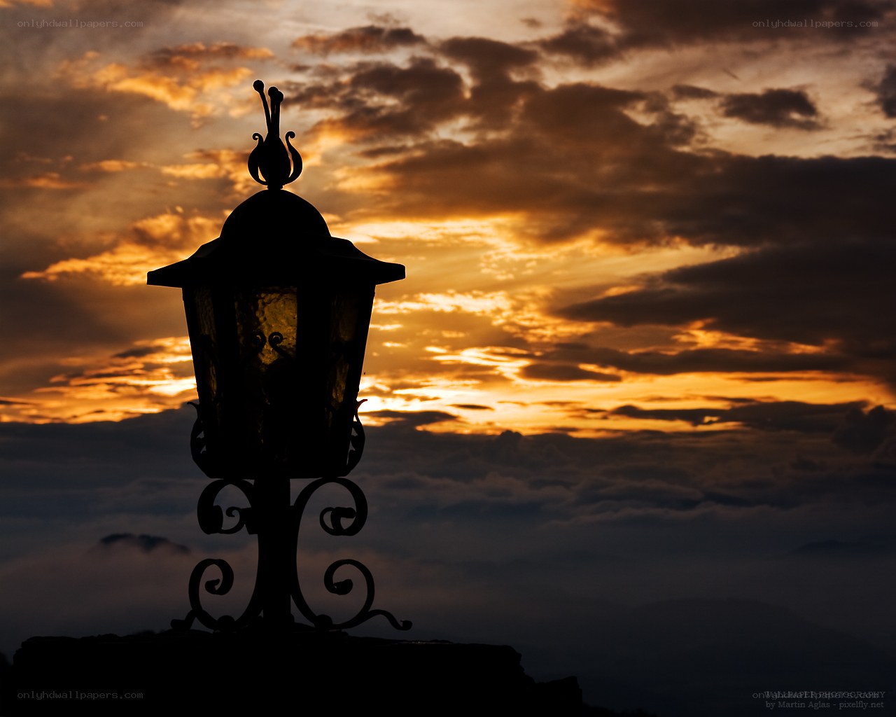 Silhouette lamp at sunset
