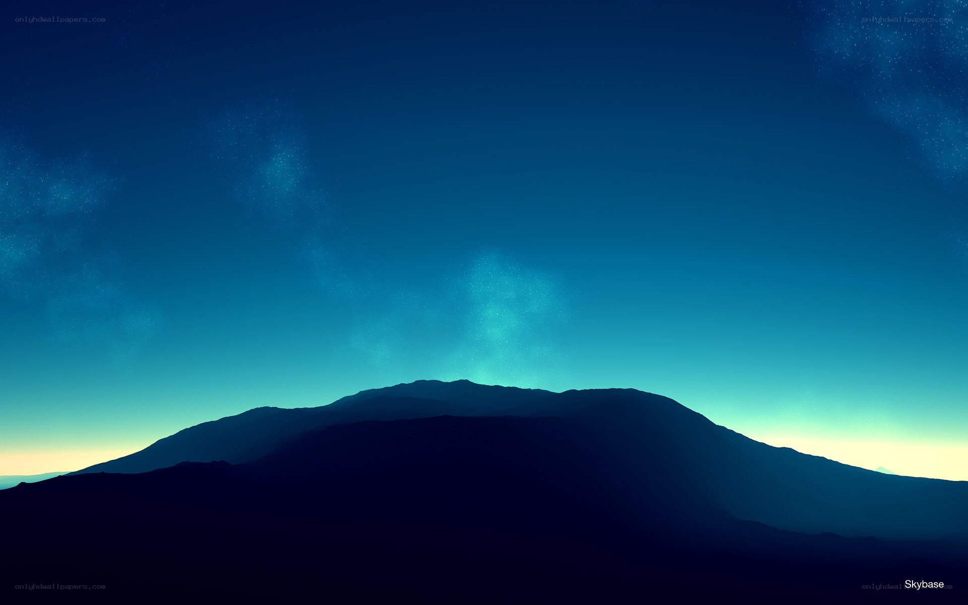 Silhouette mountain under starry sky
