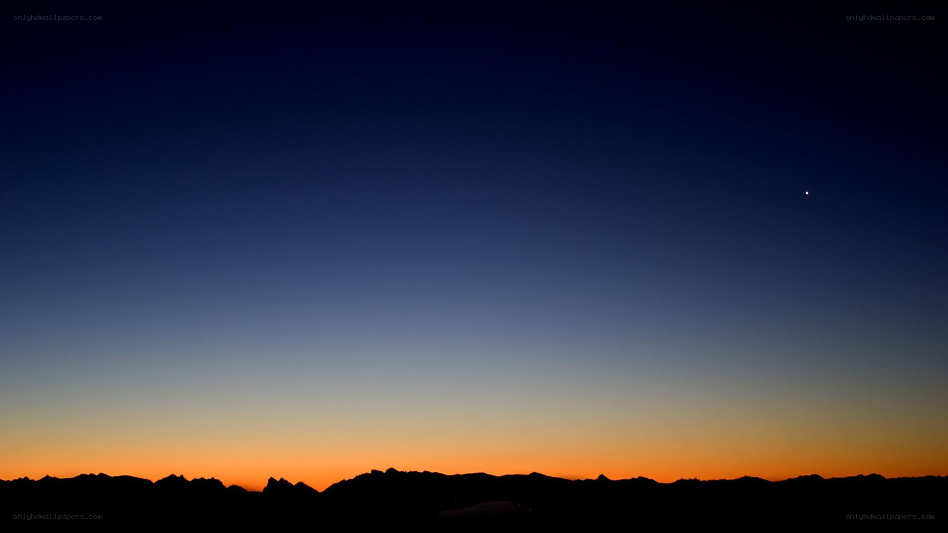 silhouette mountains at dusk