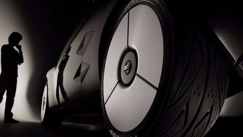 silhouette next to car wheel