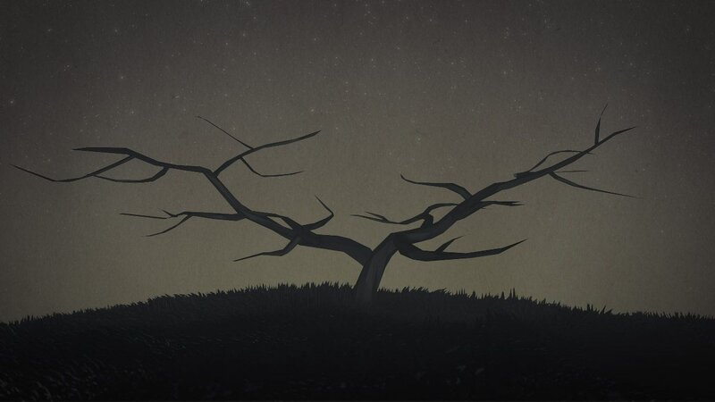 Silhouette of a bare tree at night