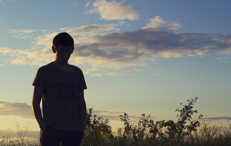 Silhouette of a boy at sunset