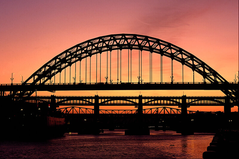 Silhouette of a bridge at sunset