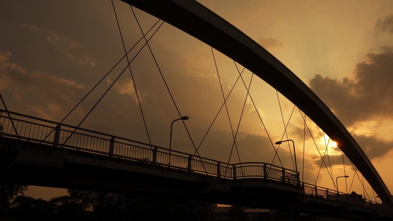 Silhouette of a bridge at sunset