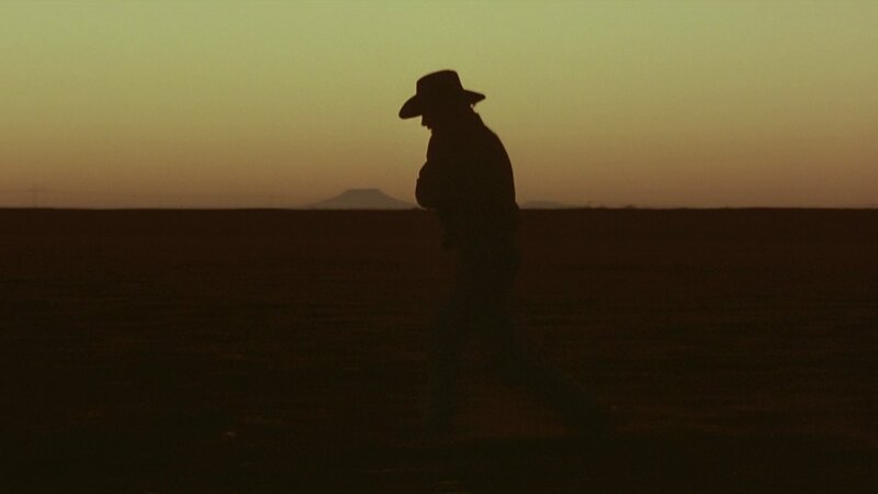 silhouette of a cowboy at sunset