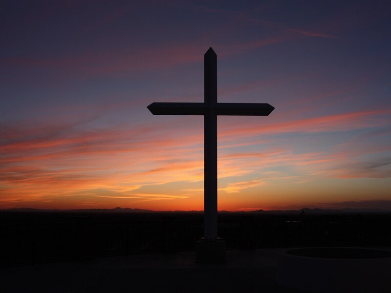 Silhouette of a cross at sunset