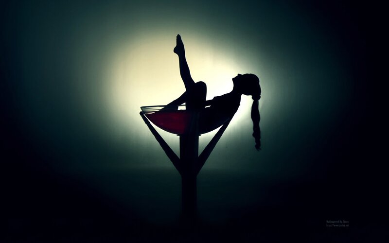 Silhouette of a dancer on a pole