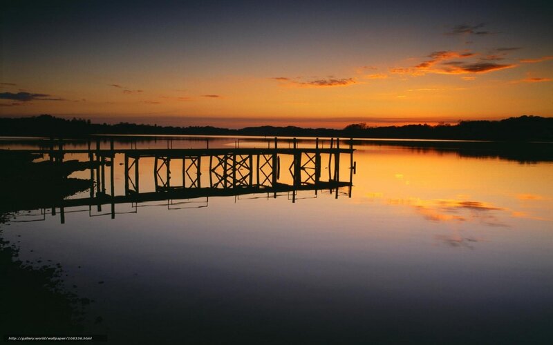 Silhouette of a dock at sunset