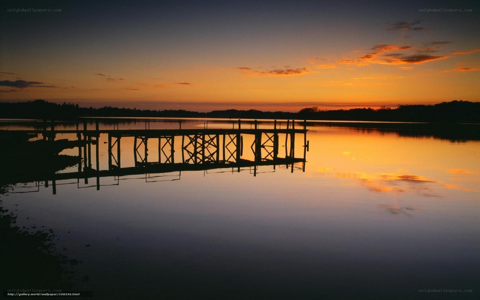 Silhouette of a dock at sunset