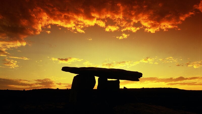 Silhouette of a dolmen at sunset