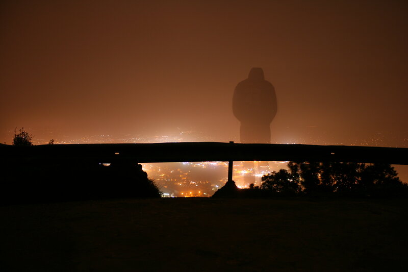 Silhouette of a figure at night
