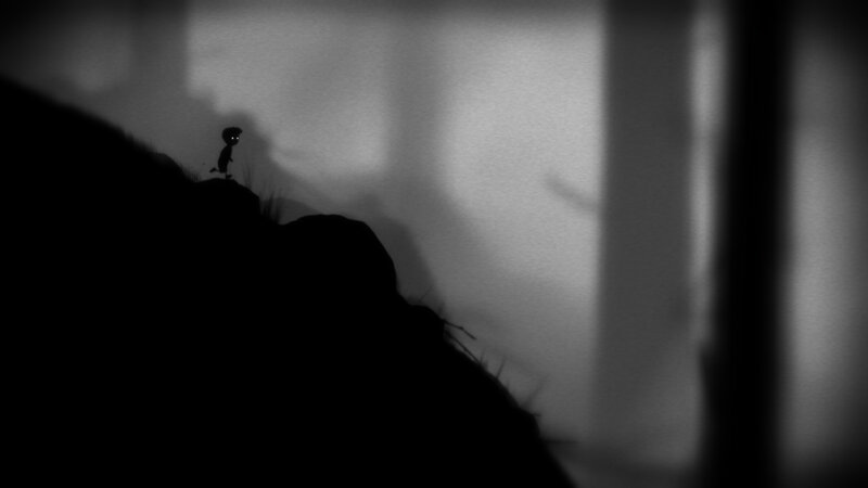 silhouette of a figure on a cliff