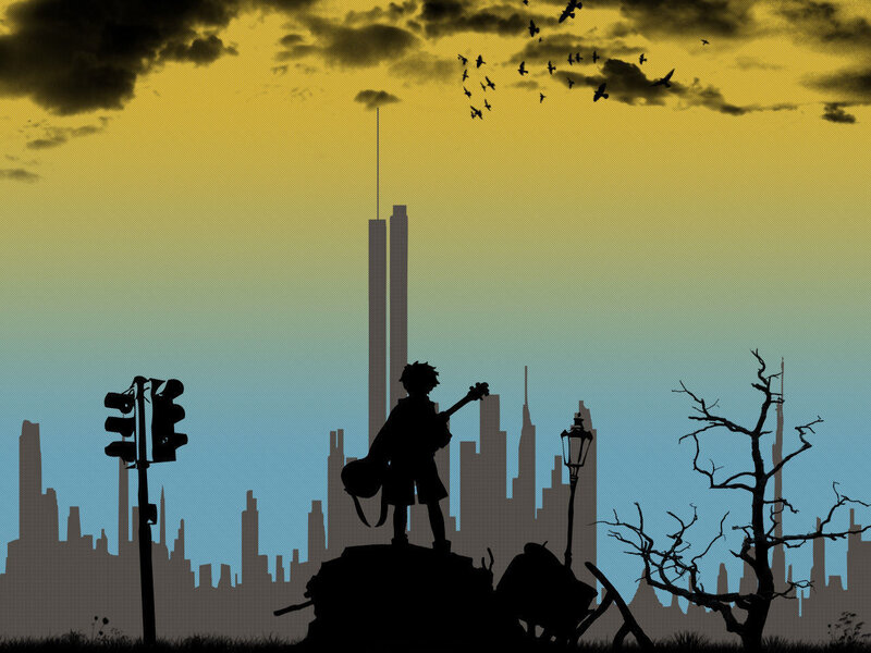Silhouette of a guitarist in a city