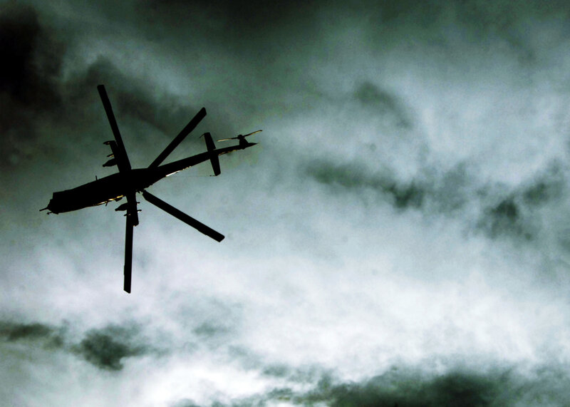 Silhouette of a helicopter in flight