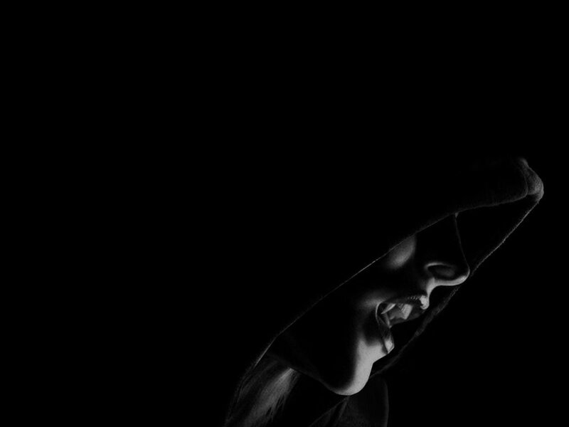 silhouette of a hooded figure