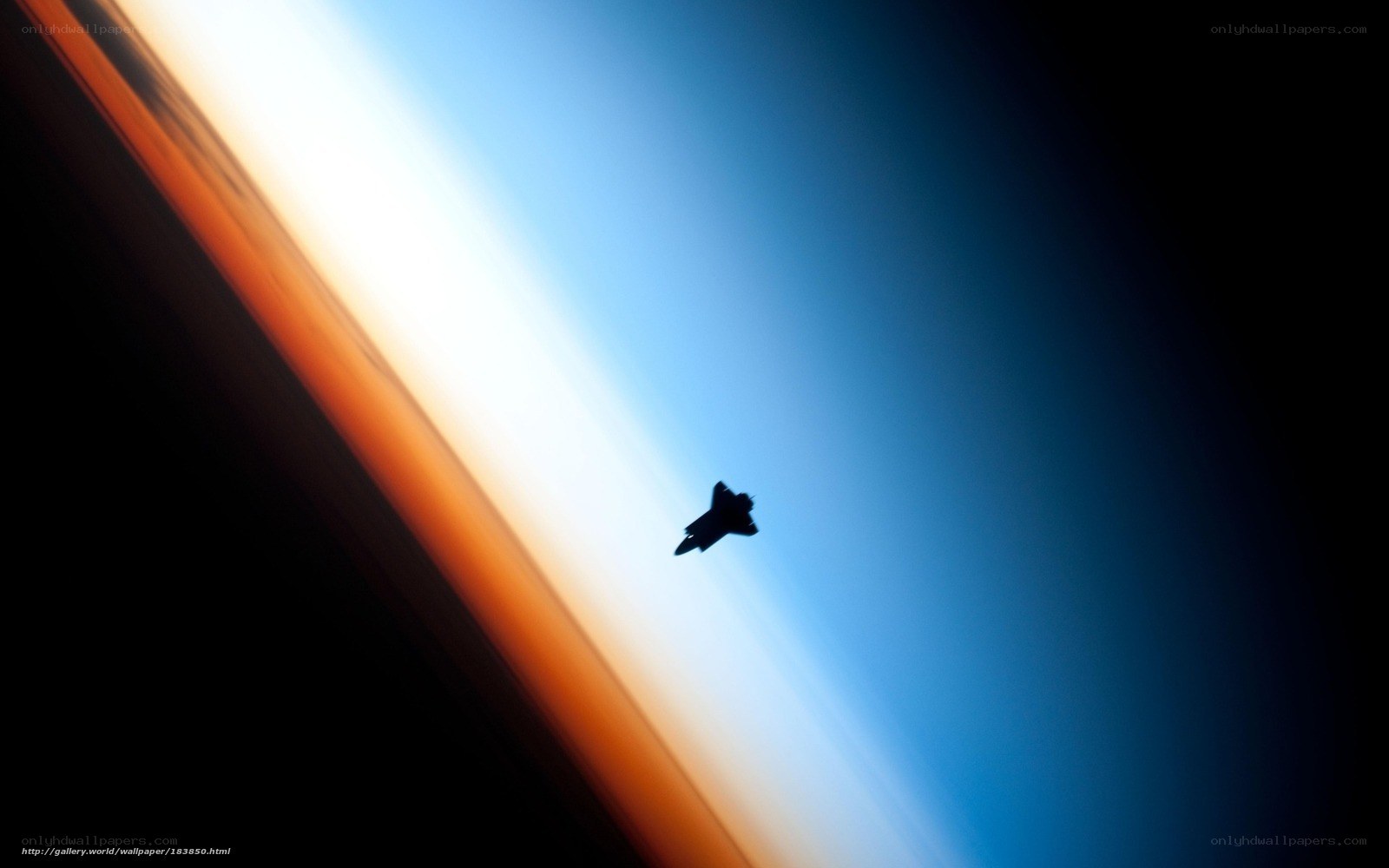 Silhouette of a jet over Earth