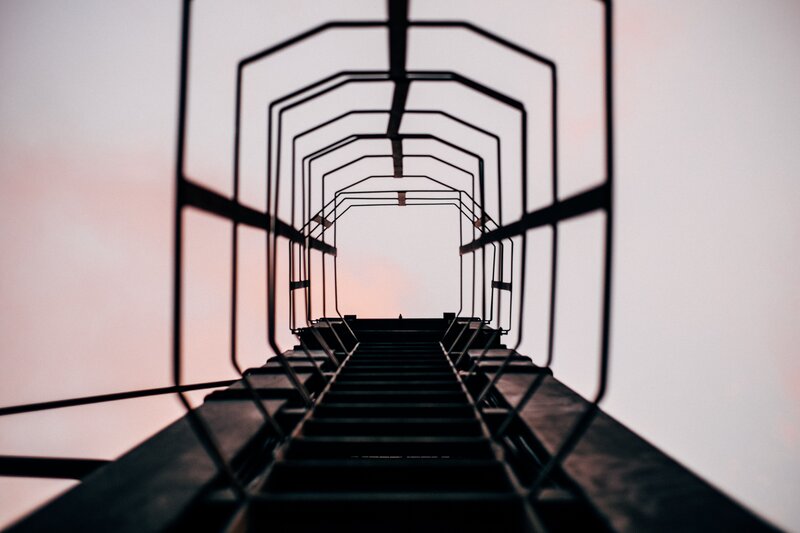 silhouette of a ladder at sunset