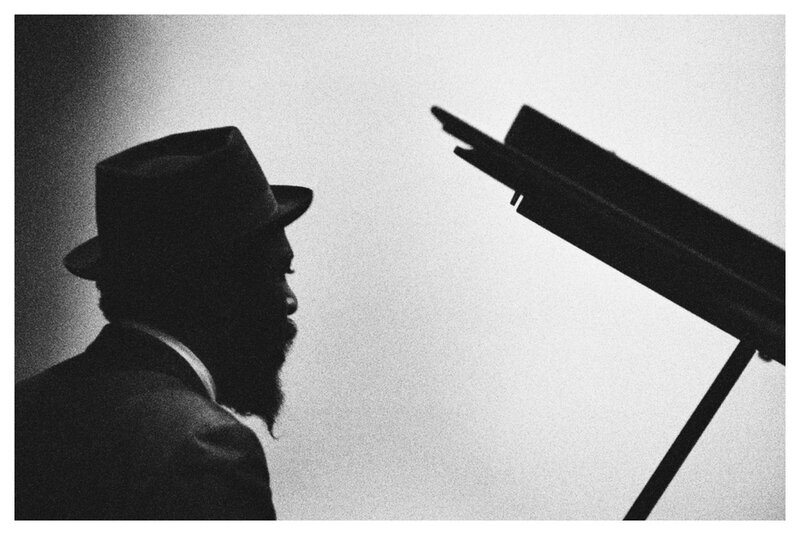 silhouette of a man at piano