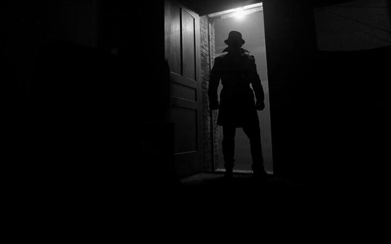 Silhouette of a man in a doorway