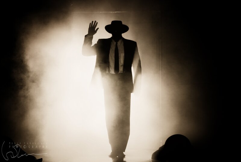 silhouette of a man in a hat