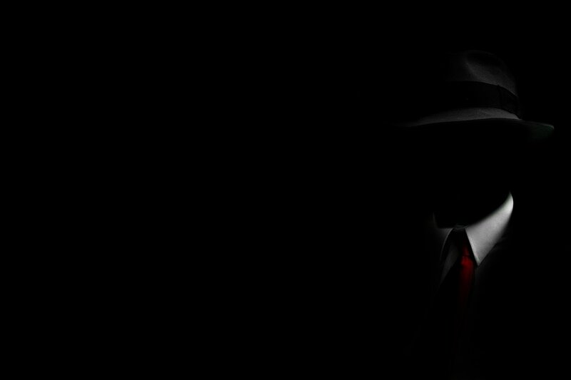 silhouette of a man in hat