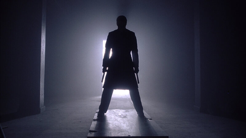 silhouette of a man with weapons