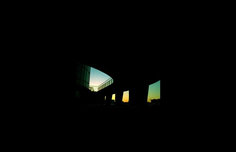 Silhouette of a modern bridge at sunset