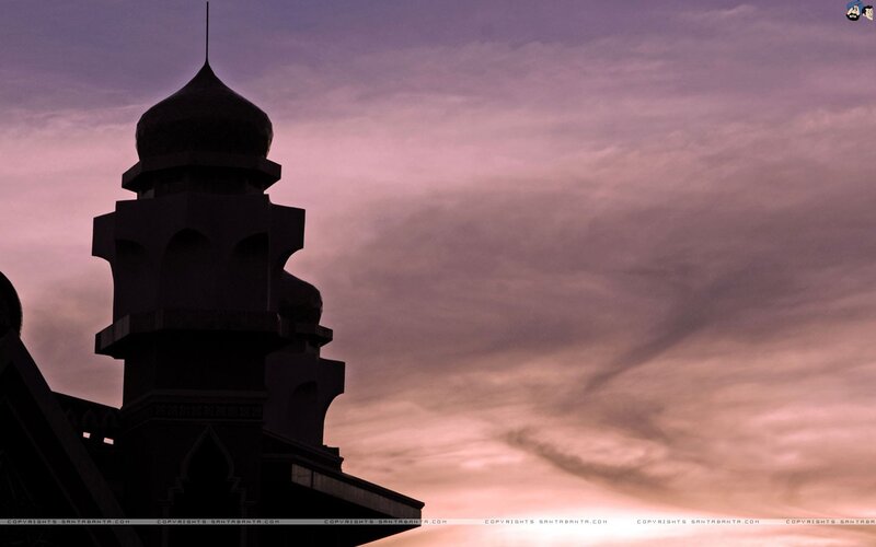 Silhouette of a mosque at sunset
