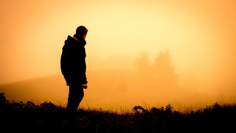 Silhouette of a person at sunrise
