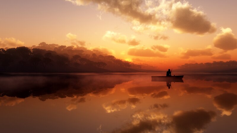Silhouette of a person in a boat at sunset